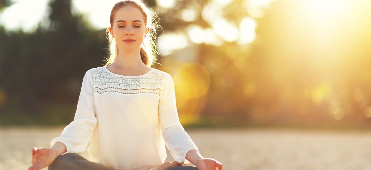 Woman,Practices,Yoga,And,Meditates,In,The,Lotus,Position,On